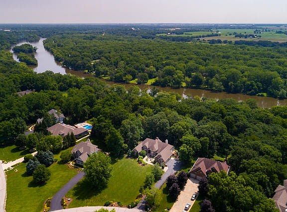 The one acre lot has beautiful mature trees, and a winding path thru the woods that ultimately leads