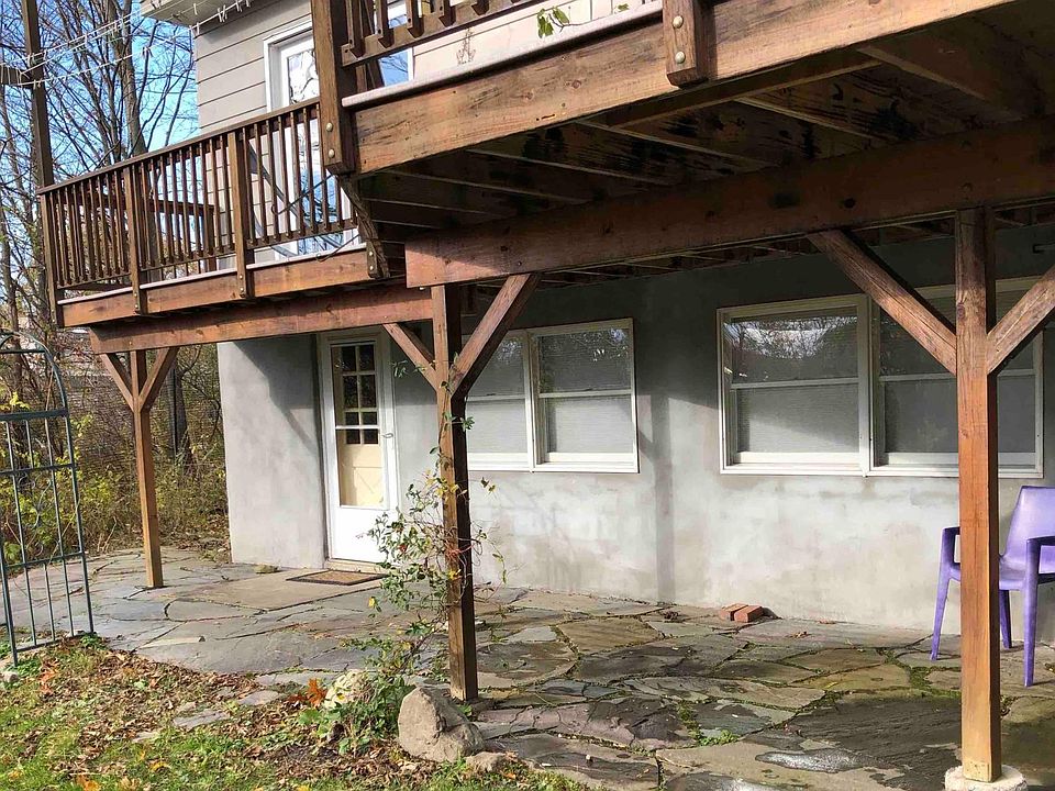 Apartment entrance, patio. Note insulated blinds on all windows.