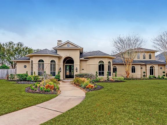 This home has tons of windows to let in natural light and has the WOW factor as you drive up!