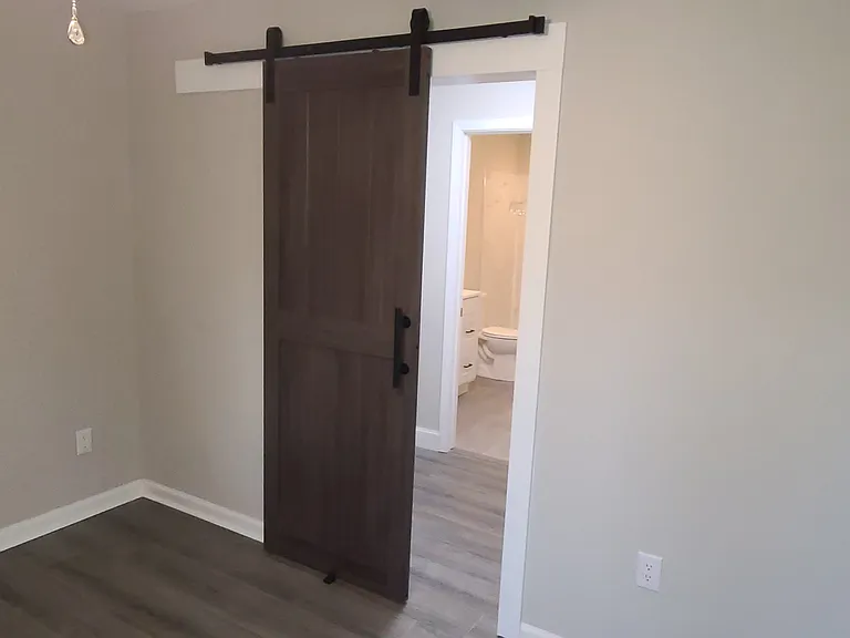 309 Unit B Closet with farm house slider