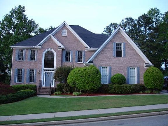 3 1/2 sides brick, 3-car garage and Heated Inground Pool on cul de sac setting