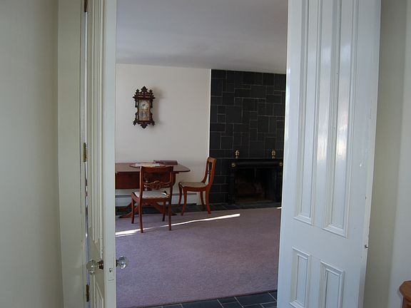 French door entry to formal living room with library