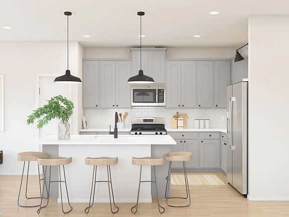 Kitchen with pendant lighting and center island - Artist Rendering