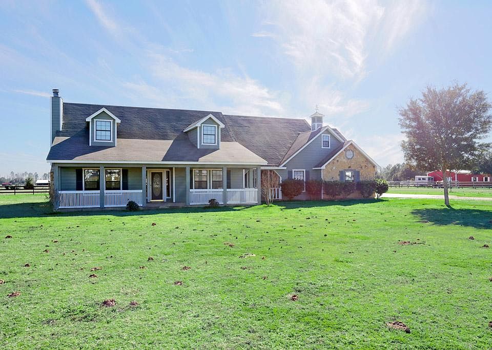 This custom farmhouse on 3 acres is located in a friendly neighborhood with similar homes. No Mobile homes allowed in 6T Ranch Estates!