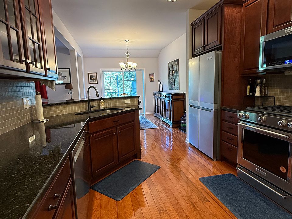 Large kitchen with granite countertops and breakfast bar