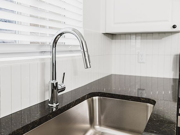 Chrome kitchen faucet with pull down spray head