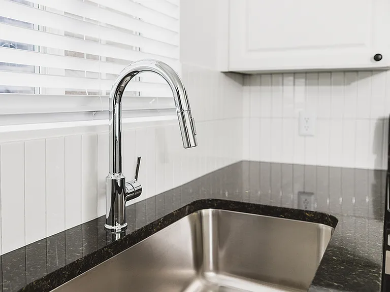 Chrome kitchen faucet with pull down spray head