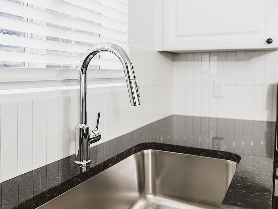 Chrome kitchen faucet with pull down spray head