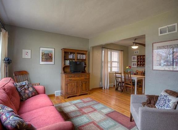 You will enter into a light and bright living room with gleaming wood floors