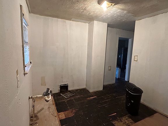 Kitchen area that will be all new flooring, cabinets, countertops and appliances