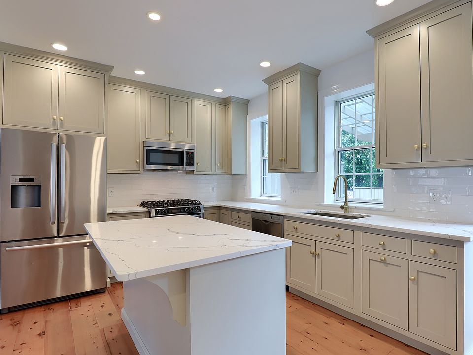 High end kitchen with inset cabinets to the ceiling
