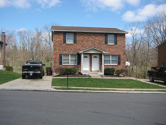 Front of the residence offers private driveway