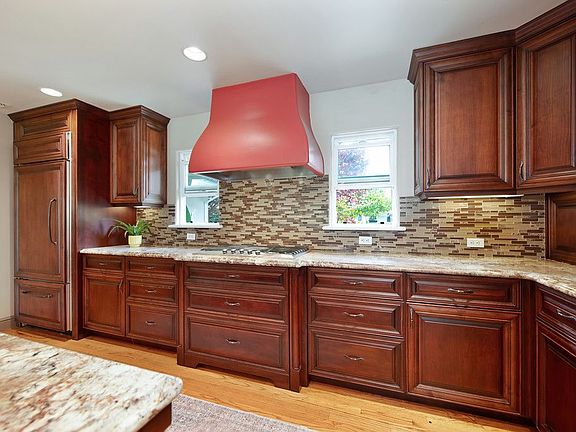 Kitchen with built-in fridge and dishwasher cabinet panels