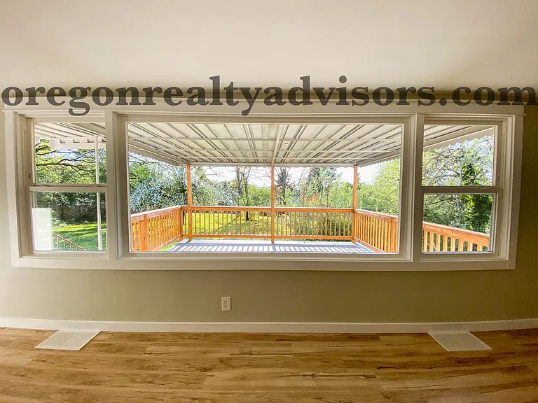 Living Room picture window overlooking back yard