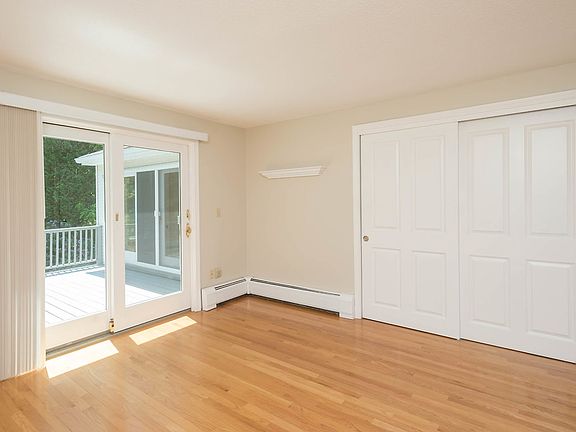 master bedroom with a sliding door to the deck