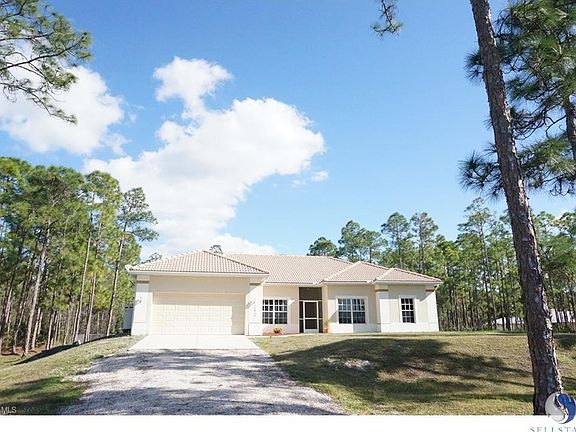 Long driveway with a concrete parking area on 10 acres. The road leading to the house is paved and has well maintained 10 to 20 acre properties. Horses are allowed and there is plenty of room for a pool and spa as well as a barn.