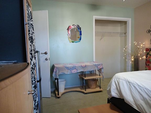 Lockable artful bedroom with coffee beverage place microwave small 10-ft cubic fridge/freezer, closet, delineated computer area. Shared bath kitchen and very artful sitting parlor with 50 inch smart TV.