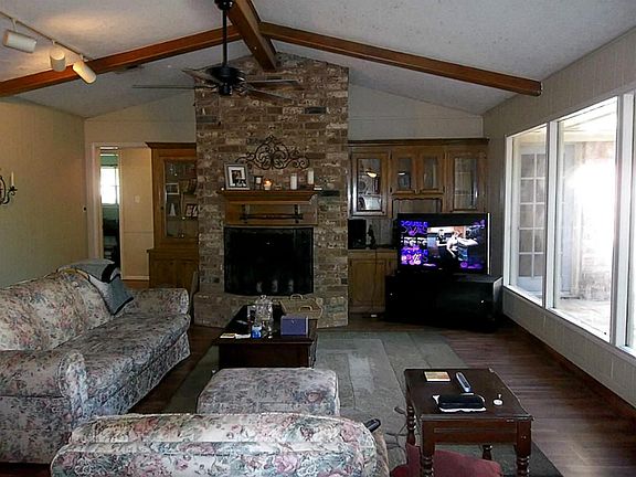 Large Den (18x21) with High Ceiling and Fireplace * Wall of Windows Overlook Patio and Beautiful Back Yard