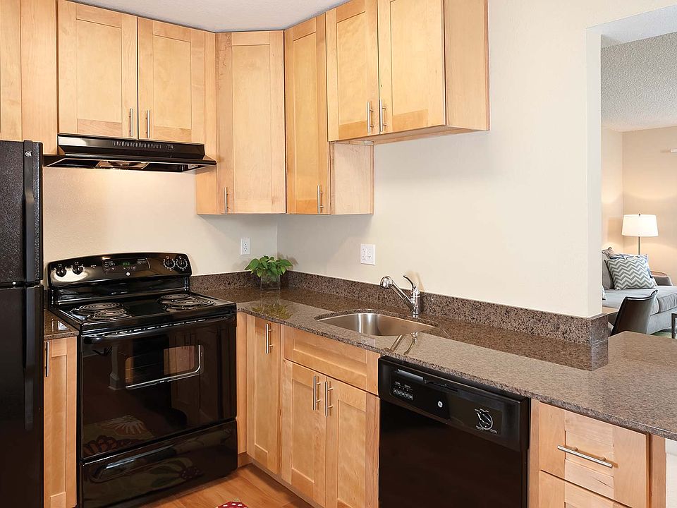 Kitchens features tone countertops and updated appliances.