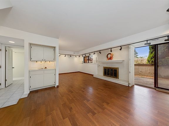 Family Room has a Fireplace, Wet Bar, access to private Patio.