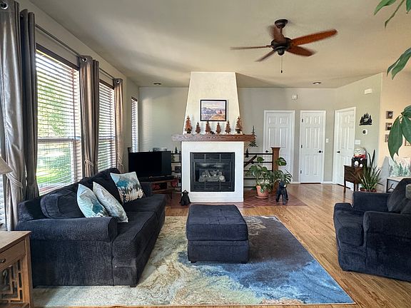 Main level living area with gas fireplace, window wall