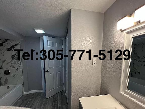 Bathroom from inside with view of closet