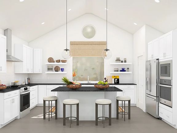 Kitchen with vaulted ceiling and pendant lighting