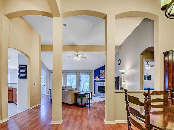 Welcome into this spacious home! The formal dining is on the right and the family room is ahead with kitchen to the left.
