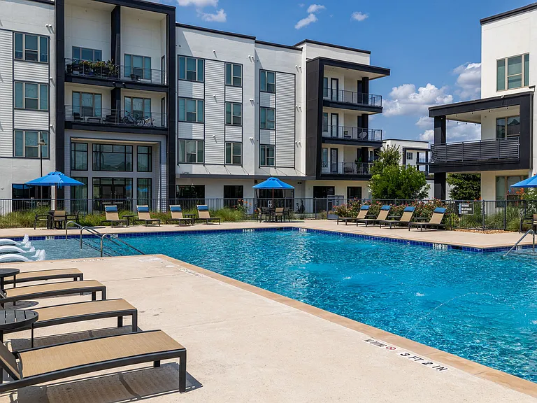 Rhythm Resort-Style Pool with Chaise Lounge Seating and Sundeck