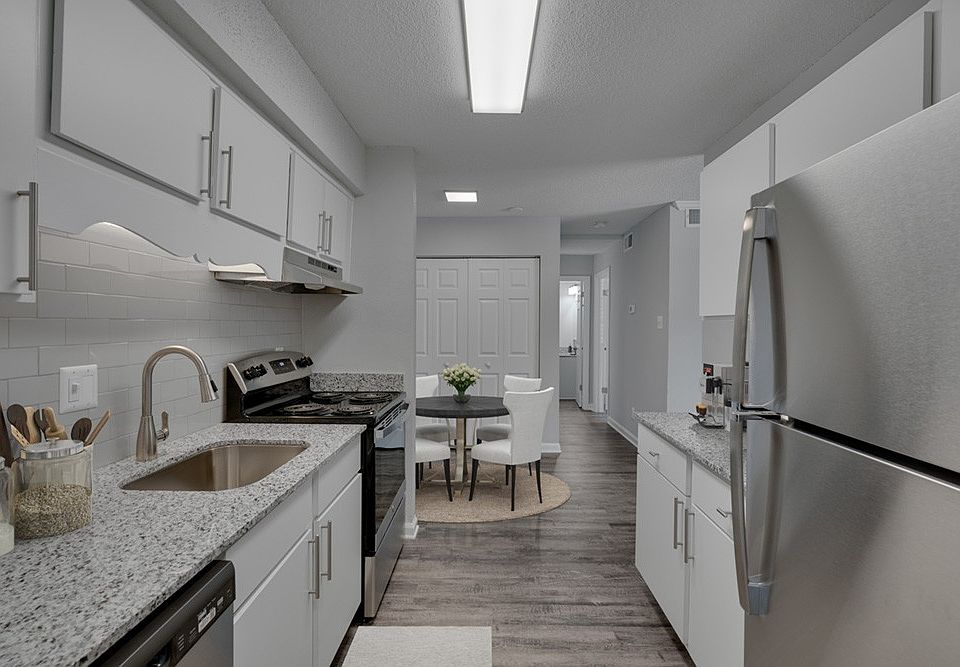 Elevate your lifestyle at Icon Downtown Durham. This modern kitchen features sleek stainless steel appliances, elegant countertops, and an inviting dining area perfect for entertaining. Don't miss outschedule your tour today!