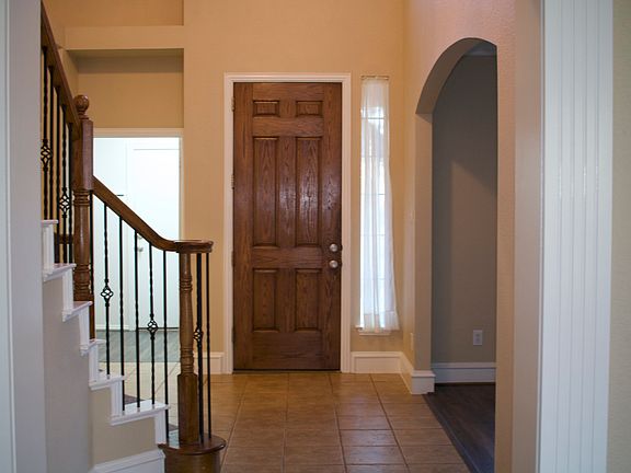 Entrance into the home with a well appointed staircase.