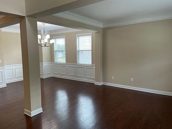 Well-lit living and dining room on right side of entry