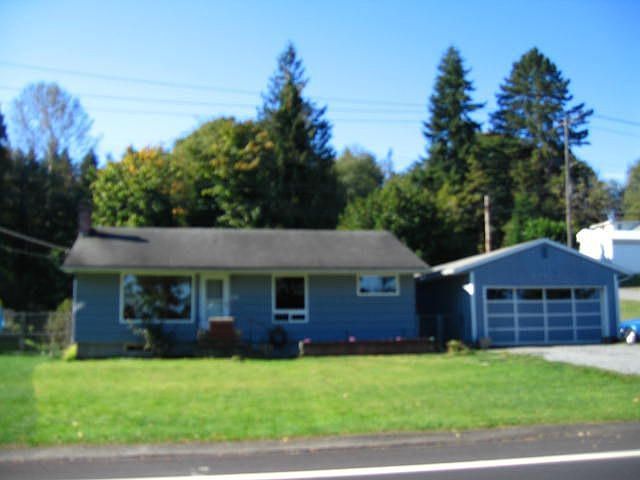 3 bedrm w/4 car gar, lg corner lot backs to open space