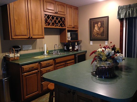 Lower level bar/ kitchenette area by pool walkout