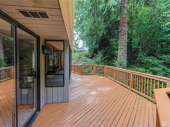 The dining room opens up to the expansive deck. Perfect for entertaining!