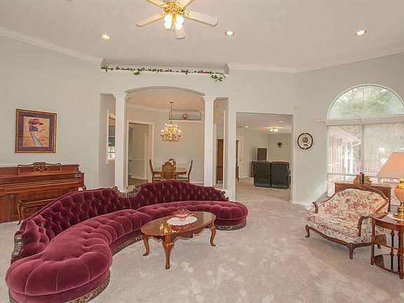 A view of the living area in the other direction reveals this room leads into the dining area and the family room on the far end. Lots of open area for entertaining.