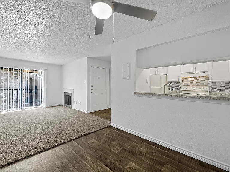 Spacious open floor plan with sliding door