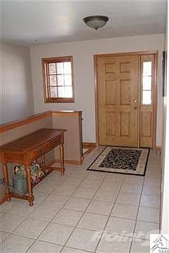 Tiled and with a large coat closet