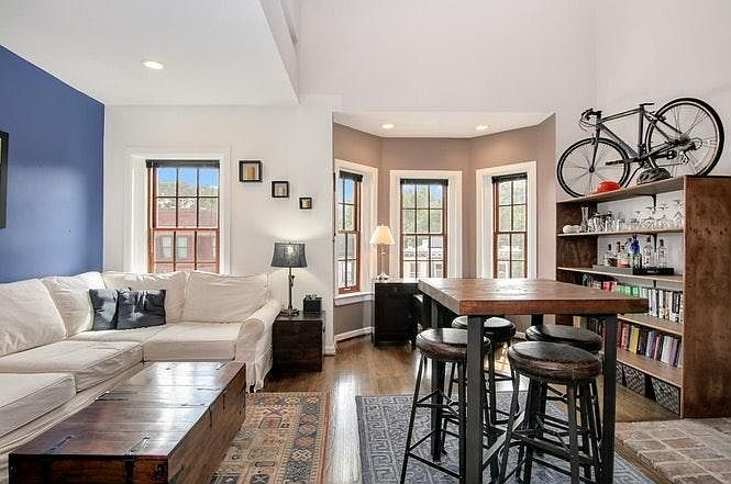Open living space, high ceilings, lots of natural light