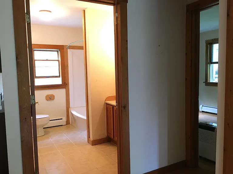 Looking into bathroom and bedroom