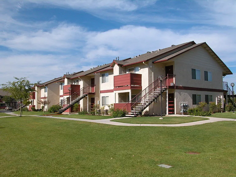 Building Exterior View From Grass Area
