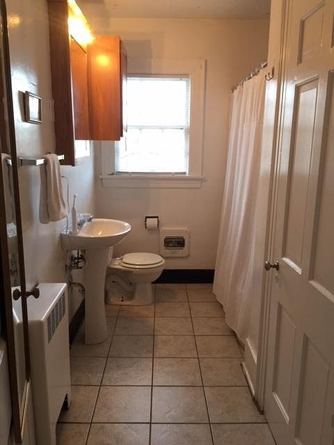 Full bathroom with large closet
