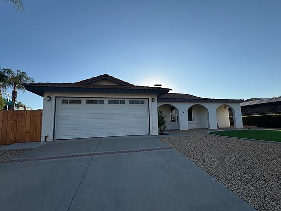 2 car garage with gate for trash cans
