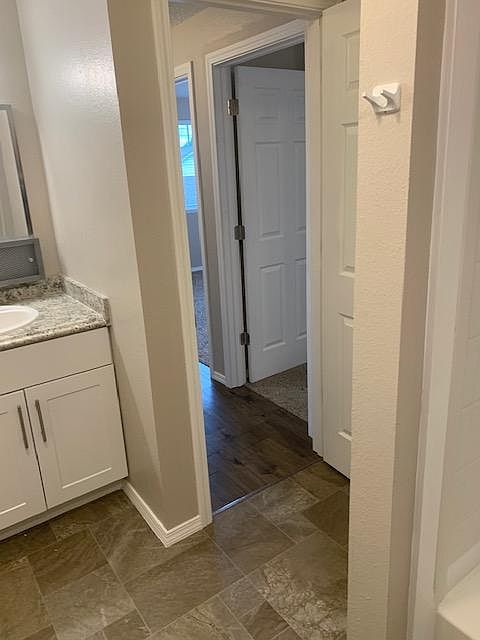 Out into the hallway from the bathroom