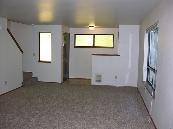 Living room, entry, stairway to second floor.