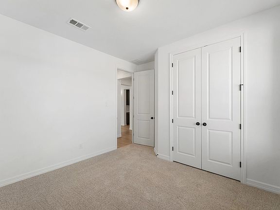 An additional view of the fifth bedroom and closet.