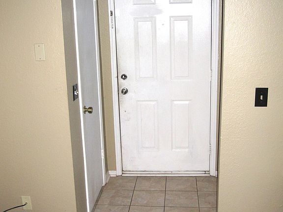 Condominium has tiled floor for the cute entry way that lea