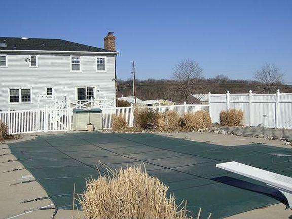 Fenced in-ground pool area