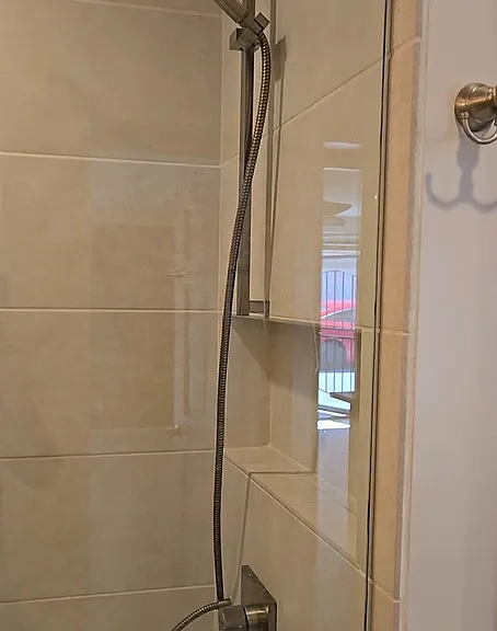 This View is showing the back section of the Shower with Dual Shower Head on both side of the Glass Shower enclosure