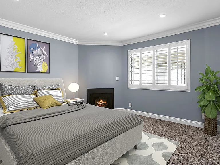Brightly lit upstairs bedroom with new carpeting.
